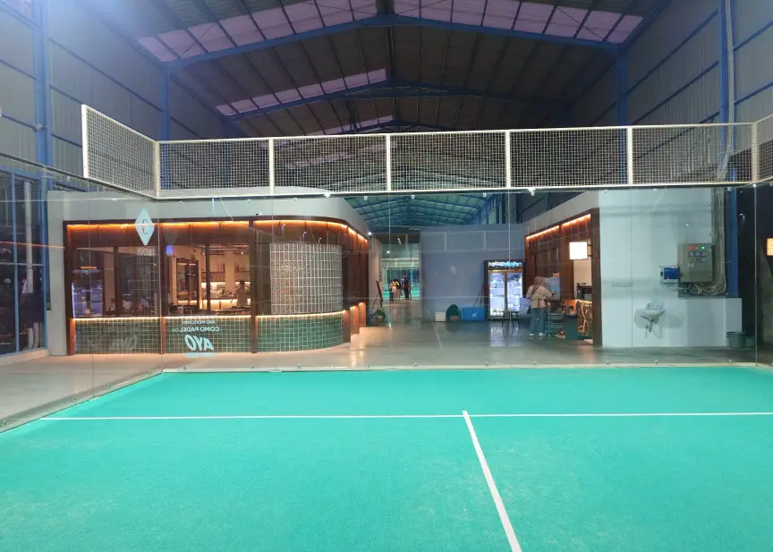 Turquoise court with the café behind the glass